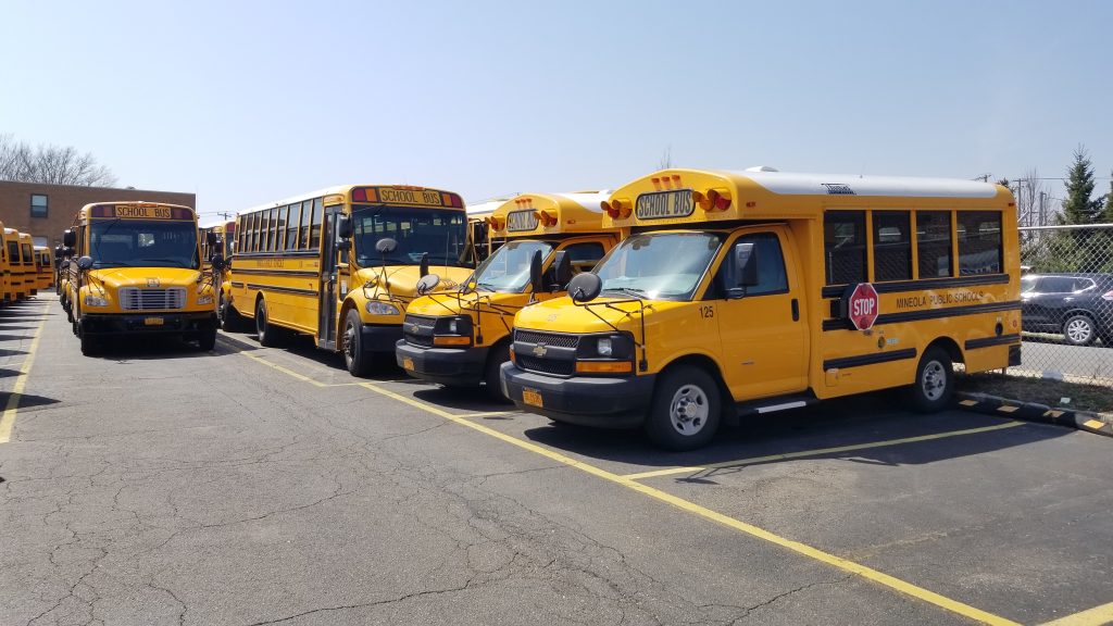 Mineola County school buses on Long Island siting ilde during the COVID-19 outbreak.