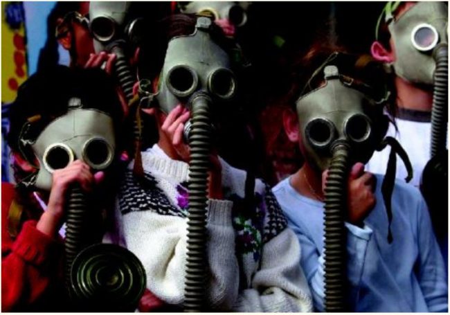 Kids wearing gas masks